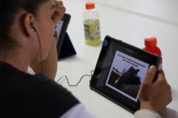Image of Student with iPad at Dairy Training 